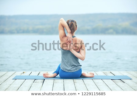 beautiful-young-woman-practices-yoga-450w-1229115685